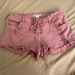 blush colored billabong denim shorts